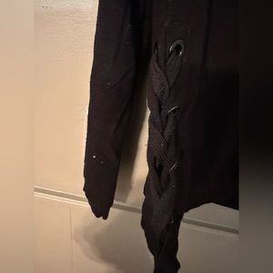 Size large. 90 degree pullover with ribbon on the sides. Black